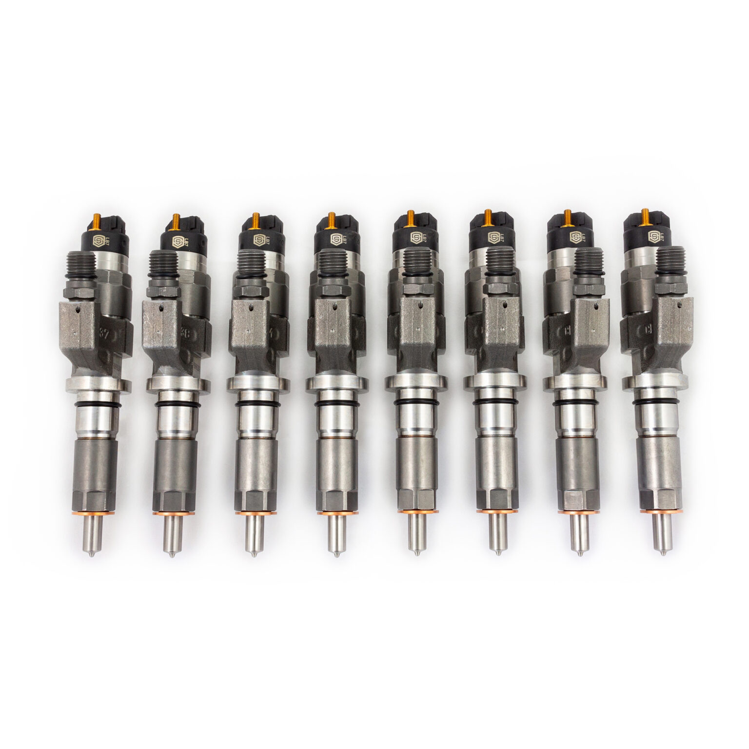 LB7 Duramax Injectors displayed alongside one another in front of a white background.